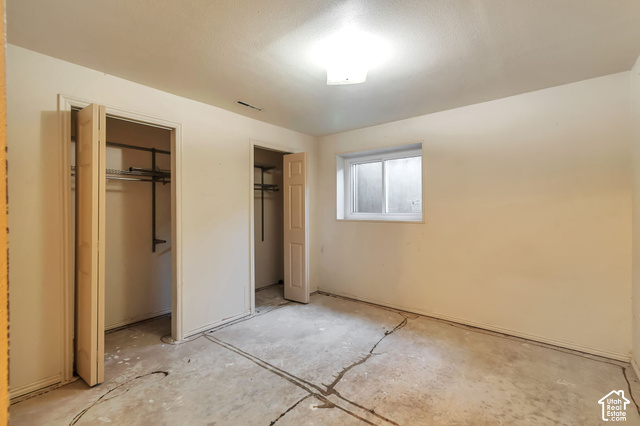 386 North 210 East Mapleton, UT 84664 - Photo 25 of 30 Room with two bi-fold door closets, a single window, and overhead lighting