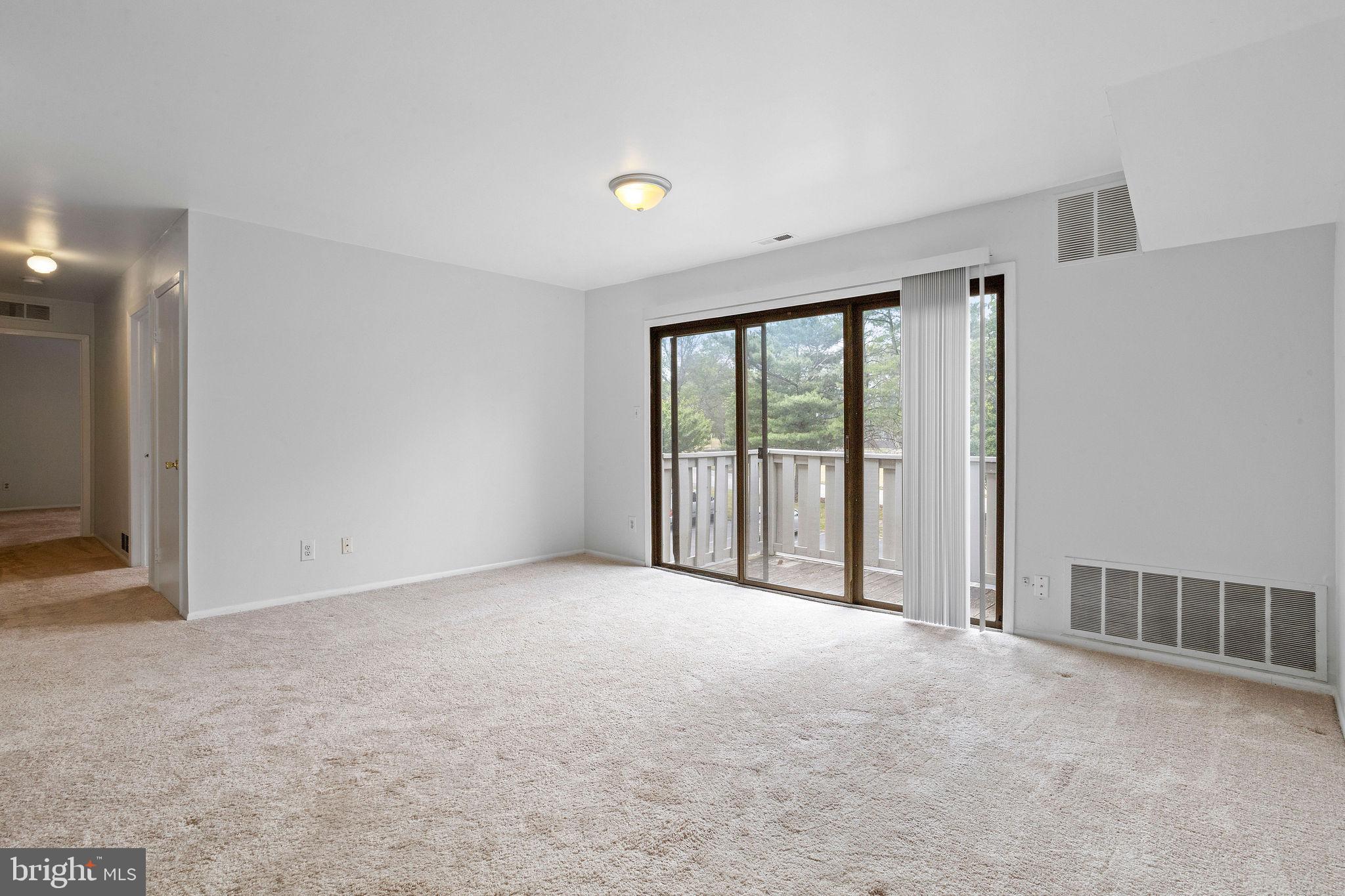 2010 Raven's Row Marlton, NJ 08053 - Photo 3 of 21 a view of an empty room with a balcony