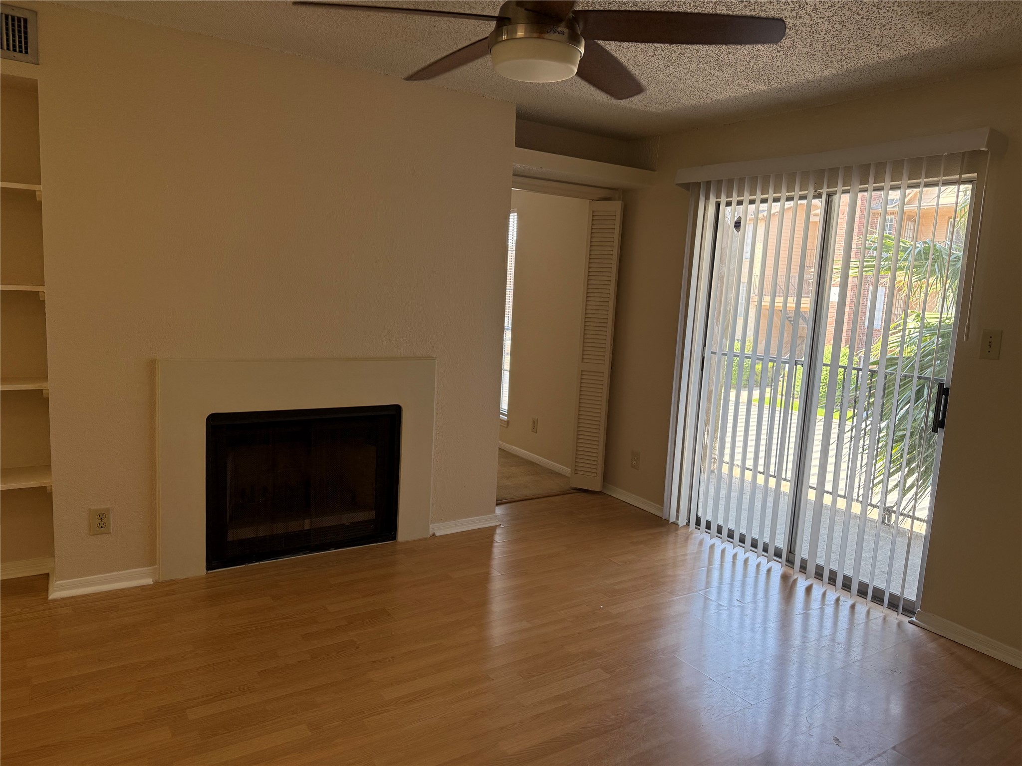 2121 Hepburn Street, Unit 1102 Houston, TX 77054 - Photo 8 of 26 a view of an empty room with wooden floor and a window