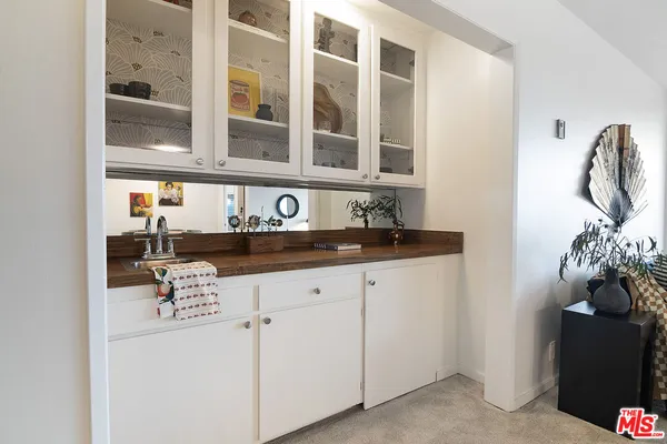 a kitchen with stainless steel appliances granite countertop a sink and a cabinets