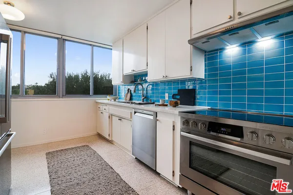a kitchen with a stove microwave and cabinets