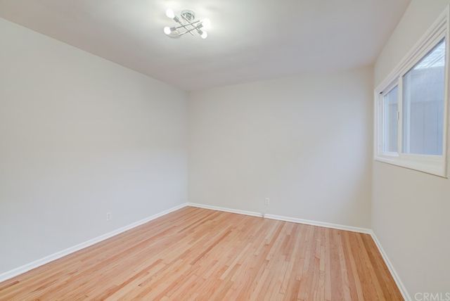 a front view of a residential apartment building with a yard