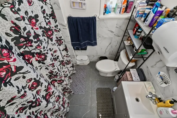 a bathroom with a sink and toilet