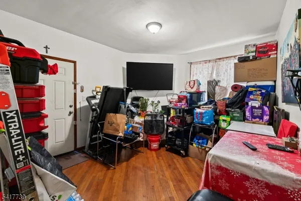 a living room with lots of furniture and a flat screen tv