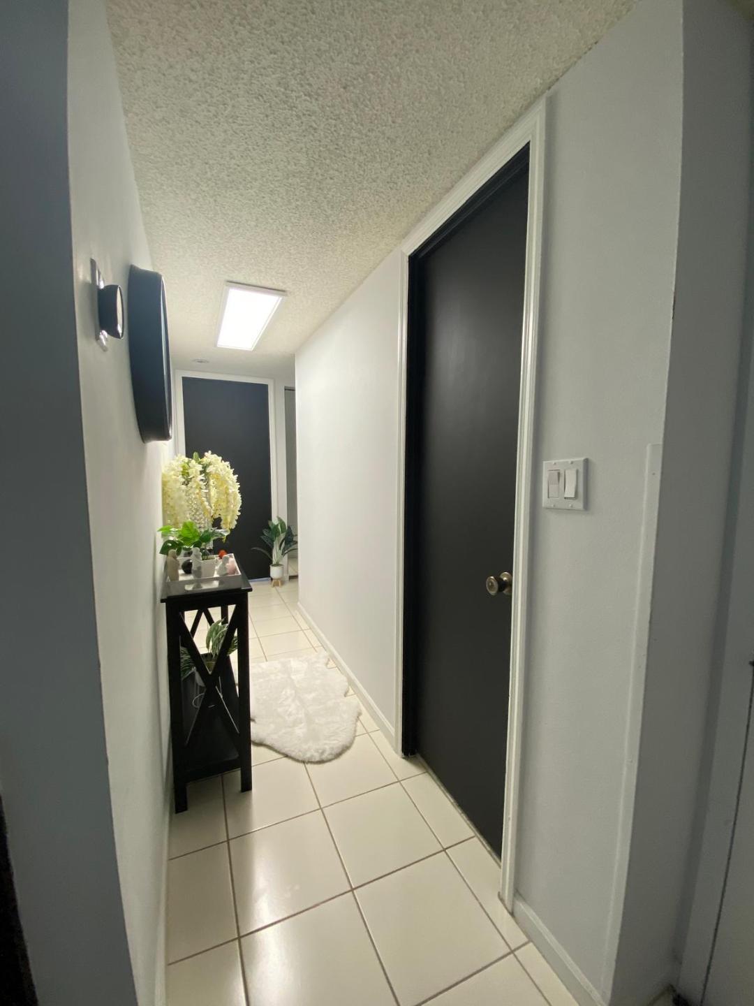 6921 Environ Boulevard, Unit 7N Lauderhill, FL 33319 - Photo 2 of 11 a living room with furniture