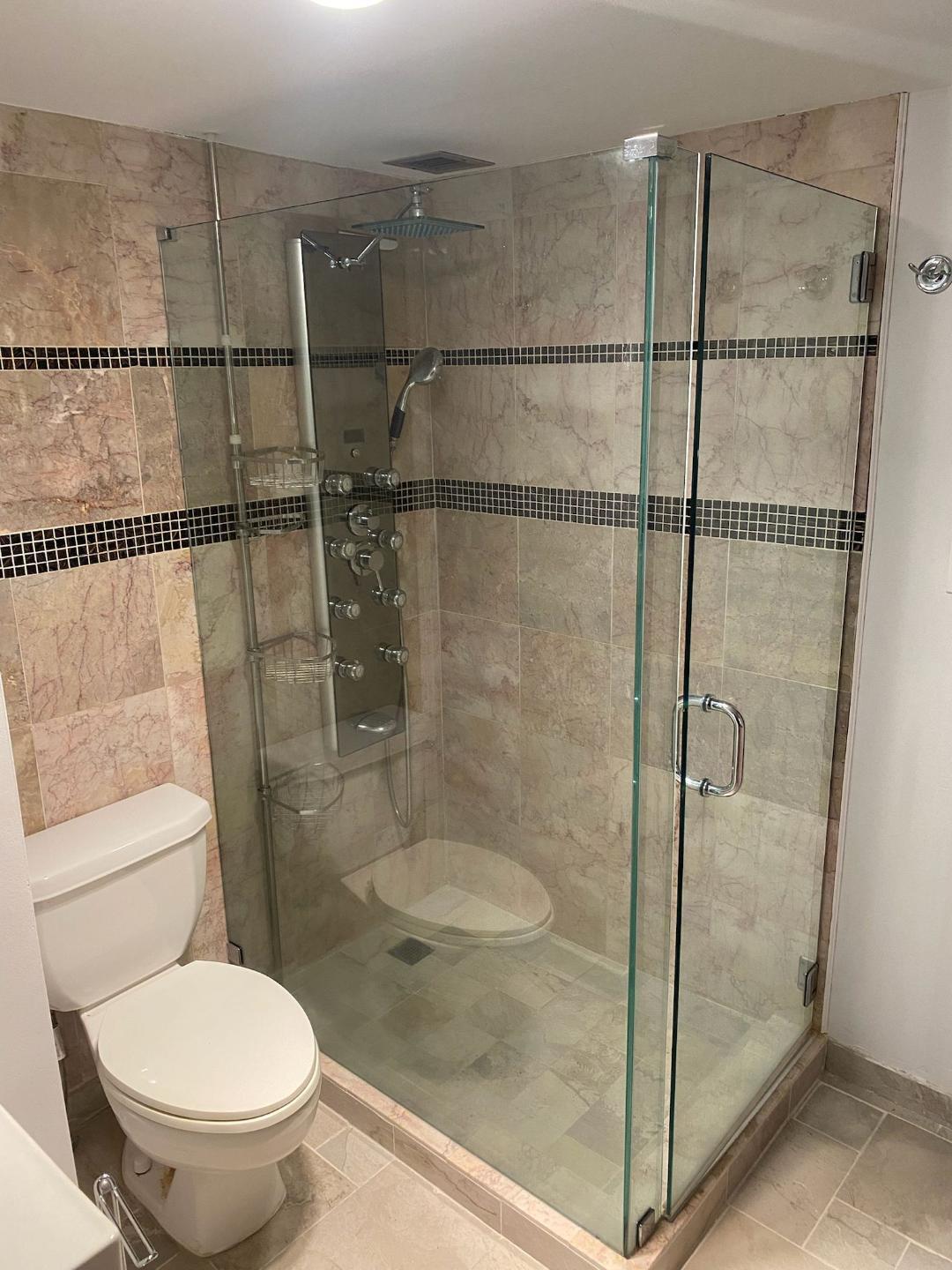 6921 Environ Boulevard, Unit 7N Lauderhill, FL 33319 - Photo 6 of 11 a bathroom with a shower and a toilet