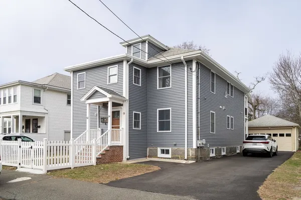 a front view of a house with a garage
