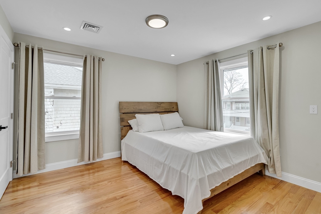 52 Holyoke Street, Unit 2 Quincy, MA 02171 - Photo 14 of 25 a bedroom with a bed and window