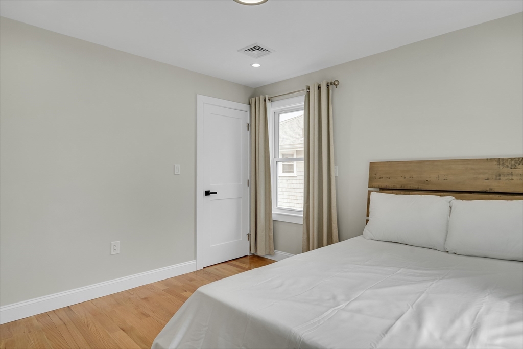 52 Holyoke Street, Unit 2 Quincy, MA 02171 - Photo 15 of 25 a bedroom with a bed and a window