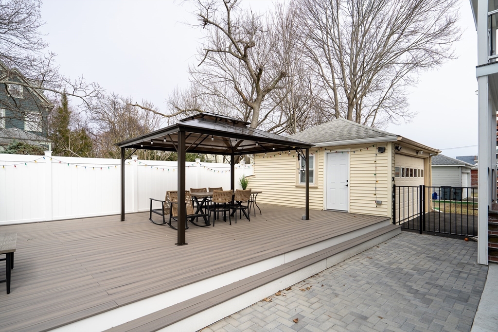 52 Holyoke Street, Unit 2 Quincy, MA 02171 - Photo 23 of 25 a view of a house with backyard and sitting area