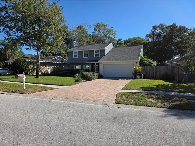a view of a house with a yard