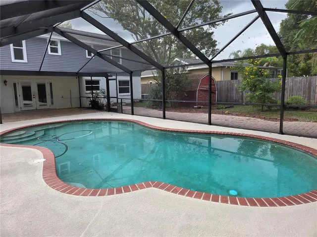 swimming pool view with a outdoor seating
