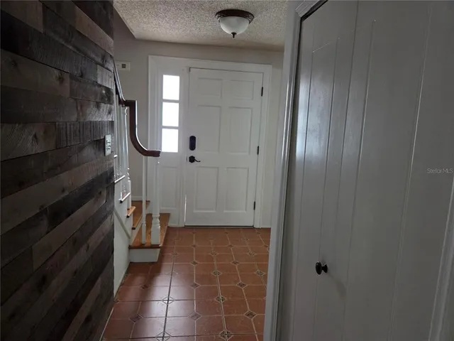 a bathroom with a glass shower door and a sink