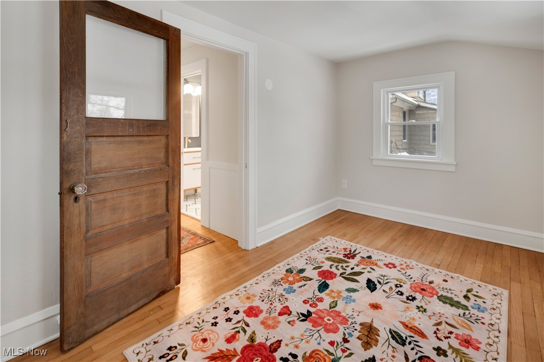 2016 Rossmoor Road Cleveland Heights, OH 44118 - Photo 31 of 46 Empty room with light wood-type flooring and vaulted ceiling