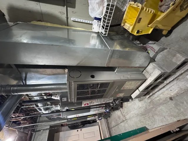 a stove top oven sitting inside of a kitchen