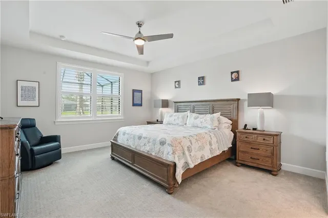 a bedroom with a bed lamp and furniture