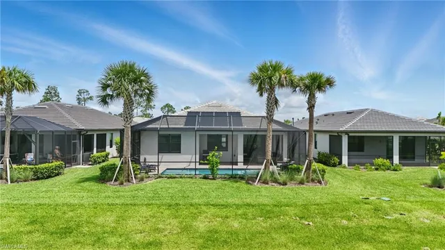 a front view of a house with a yard table and chairs
