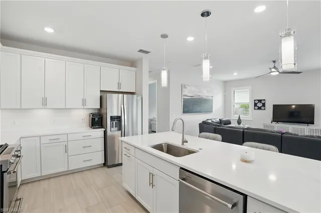 a kitchen with counter top space cabinets and stainless steel appliances