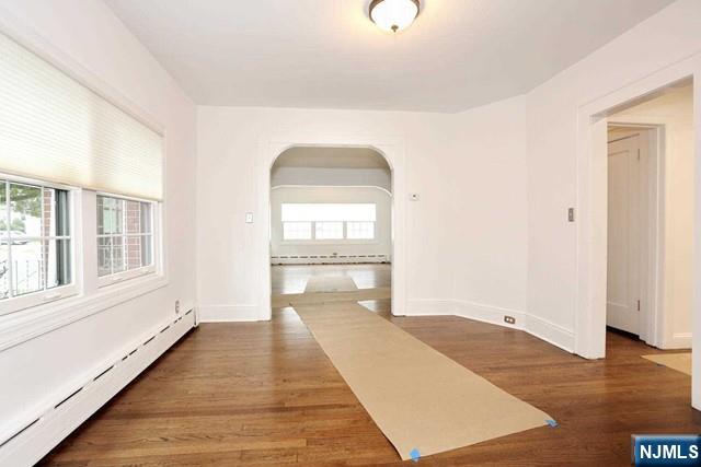 220 Raymond Street Hasbrouck Heights, NJ 07604 - Photo 15 of 36 a view of a room with wooden floor and windows