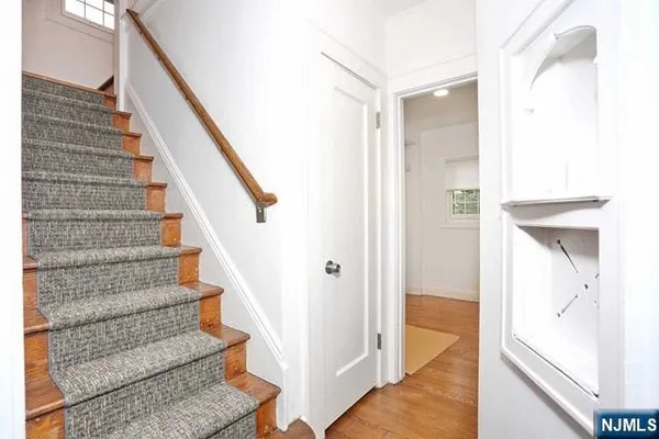 a view of an entryway with wooden floor