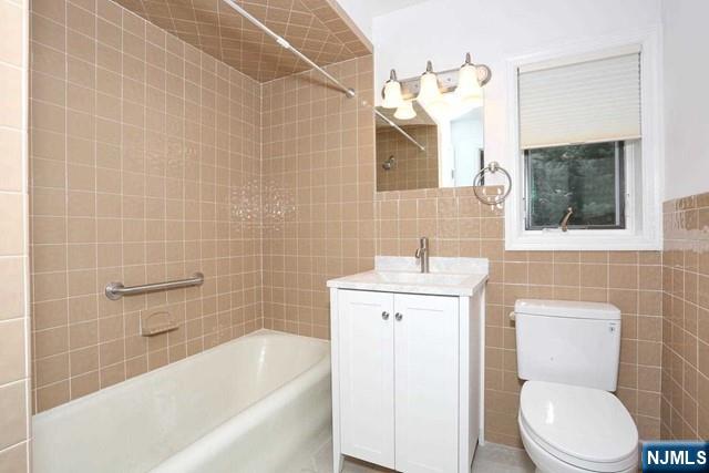 220 Raymond Street Hasbrouck Heights, NJ 07604 - Photo 21 of 36 a bathroom with a sink a toilet and bathtub