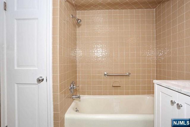 220 Raymond Street Hasbrouck Heights, NJ 07604 - Photo 22 of 36 a bathroom with a shower and a bath tub