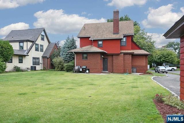 220 Raymond Street Hasbrouck Heights, NJ 07604 - Photo 35 of 36 a front view of a house with a garden