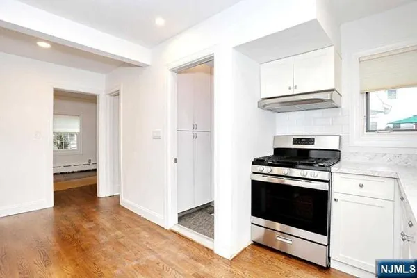 a kitchen with a stove and a sink