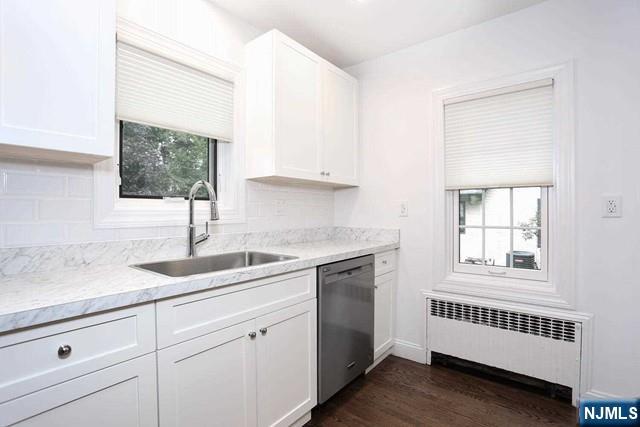 220 Raymond Street Hasbrouck Heights, NJ 07604 - Photo 7 of 36 a kitchen with granite countertop white cabinets and window