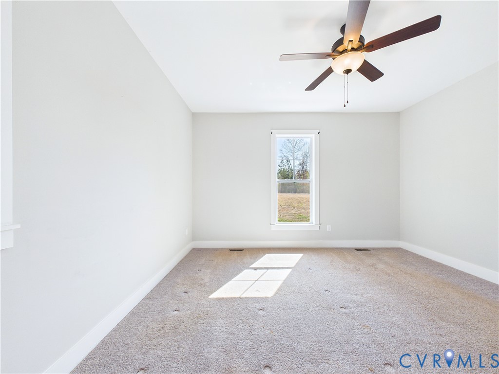 6795 Darlington Heights Road Cullen, VA 23934 - Photo 18 of 44 Empty room with a ceiling fan and carpet flooring