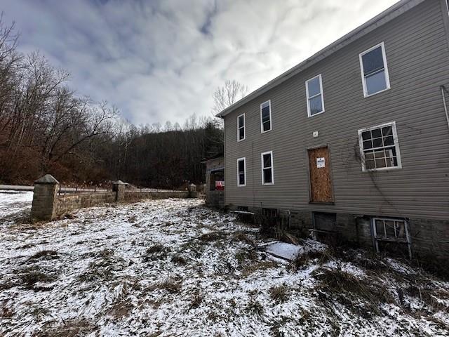 1031 Ned Ridge Road New Freeport, PA 15352 - Photo 6 of 6 a brick house with a yard and trees