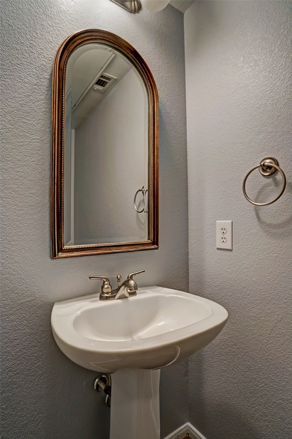 9200 Westheimer Road, Unit 907 Houston, TX 77063 - Photo 16 of 27 a bathroom with a sink and mirror