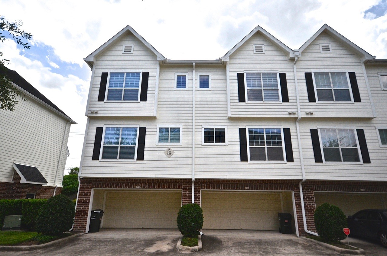 9200 Westheimer Road, Unit 907 Houston, TX 77063 - Photo 17 of 27 a front view of a house with parking