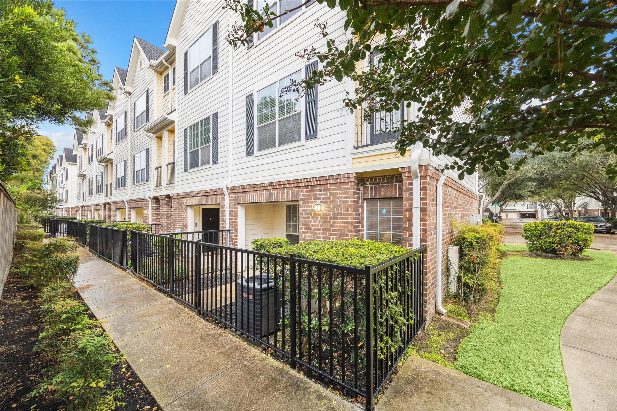 9200 Westheimer Road, Unit 907 Houston, TX 77063 - Photo 2 of 27 a view of a house with a yard