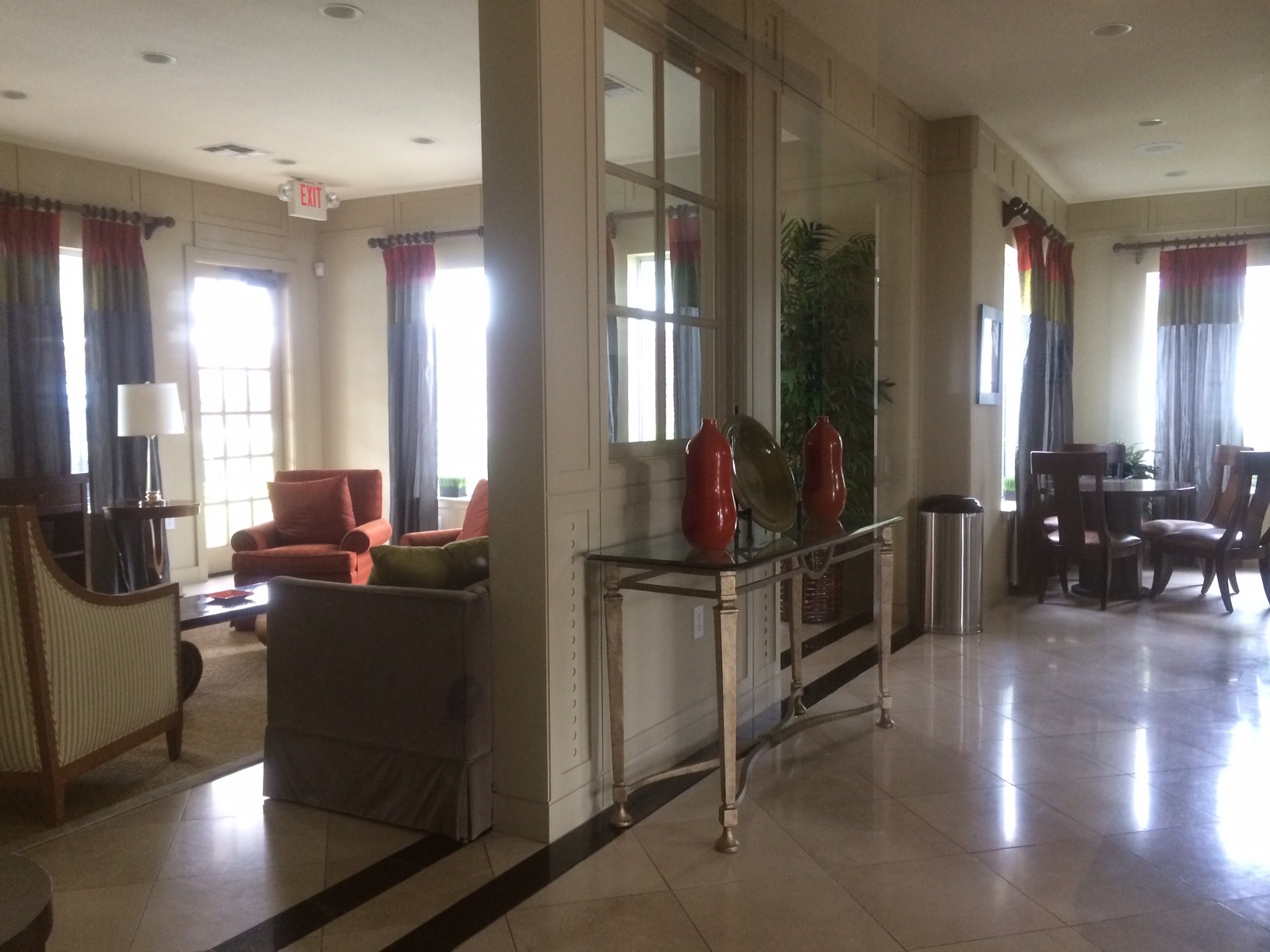 9200 Westheimer Road, Unit 907 Houston, TX 77063 - Photo 23 of 27 a room with lots of wooden furniture and windows