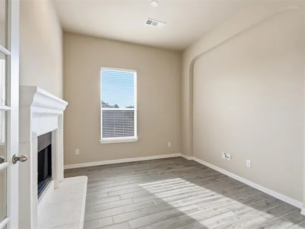 a view of an empty room and window