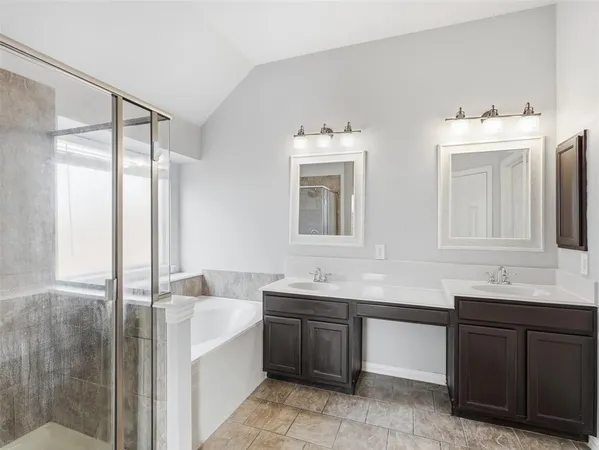 a bathroom with a tub sink and a mirror