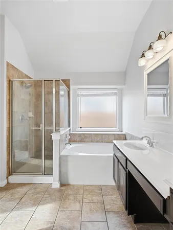 a bathroom with a sink a toilet and bathtub
