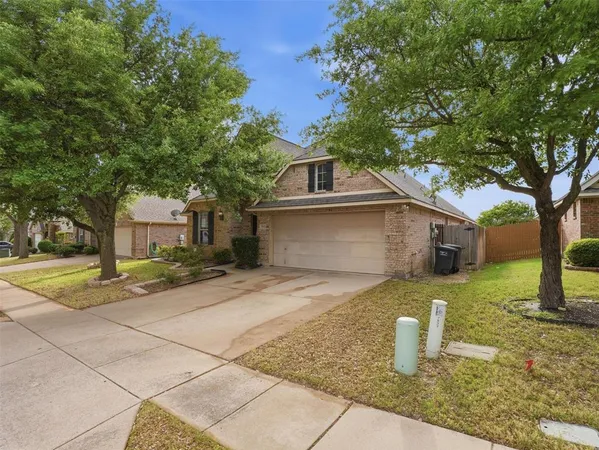 an empty room with windows and ceiling fan
