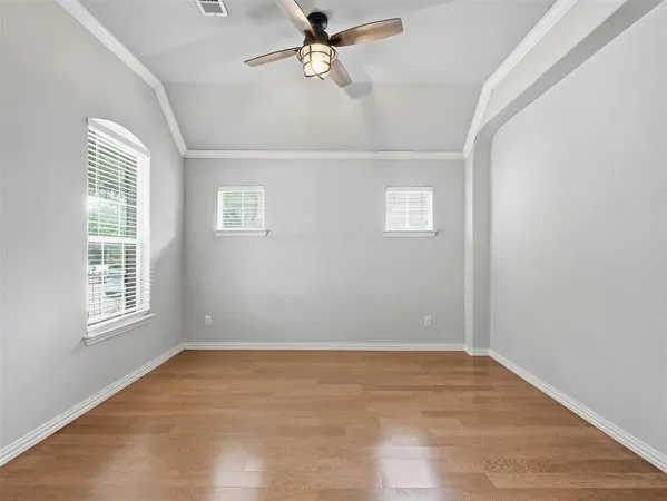 a large kitchen with stainless steel appliances kitchen island a large counter top a stove and a refrigerator