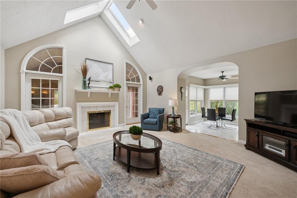 1107 Laurelview Drive Latrobe, PA 15650 - Photo 12 of 50 a living room with furniture a flat screen tv and a large window