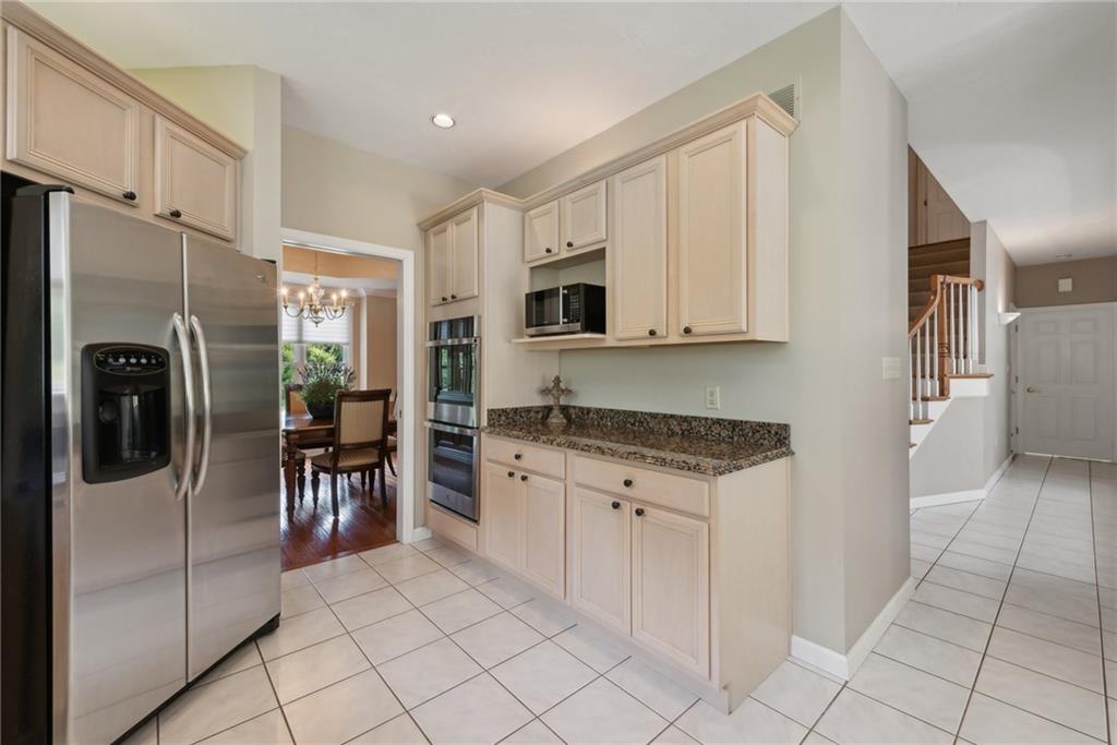 1107 Laurelview Drive Latrobe, PA 15650 - Photo 18 of 50 a kitchen with stainless steel appliances granite countertop a refrigerator and a sink