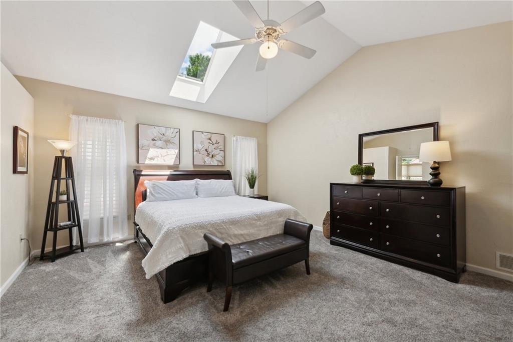 1107 Laurelview Drive Latrobe, PA 15650 - Photo 23 of 50 a bedroom with a bed and a chandelier