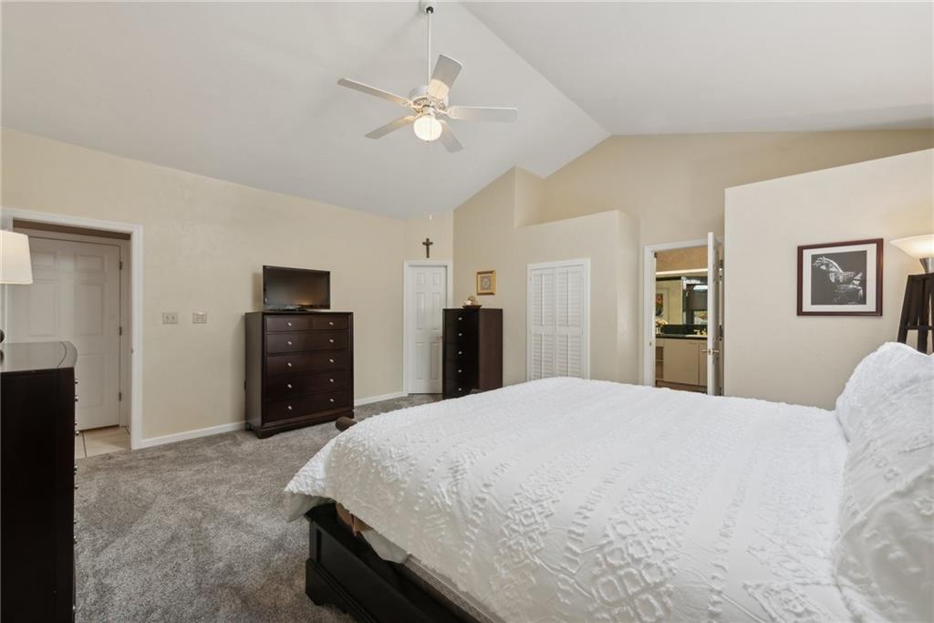 1107 Laurelview Drive Latrobe, PA 15650 - Photo 24 of 50 a spacious bedroom with a bed and a chandelier