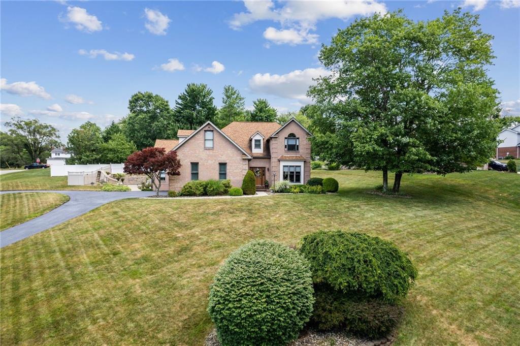 1107 Laurelview Drive Latrobe, PA 15650 - Photo 4 of 50 a front view of a house with garden