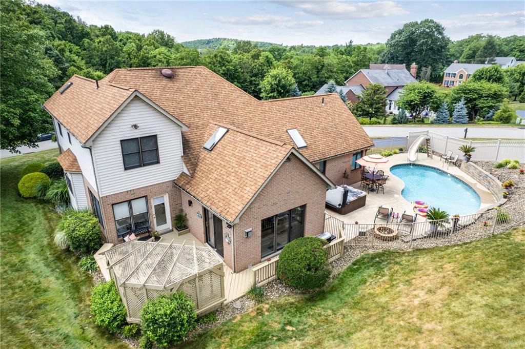 1107 Laurelview Drive Latrobe, PA 15650 - Photo 48 of 50 an aerial view of a house with swimming pool garden view and lake view