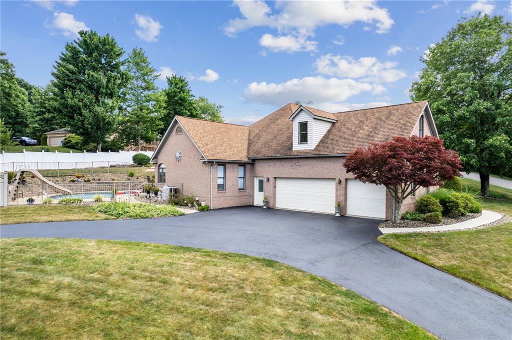 1107 Laurelview Drive Latrobe, PA 15650 - Photo 6 of 50 a view of a house with a yard and garage
