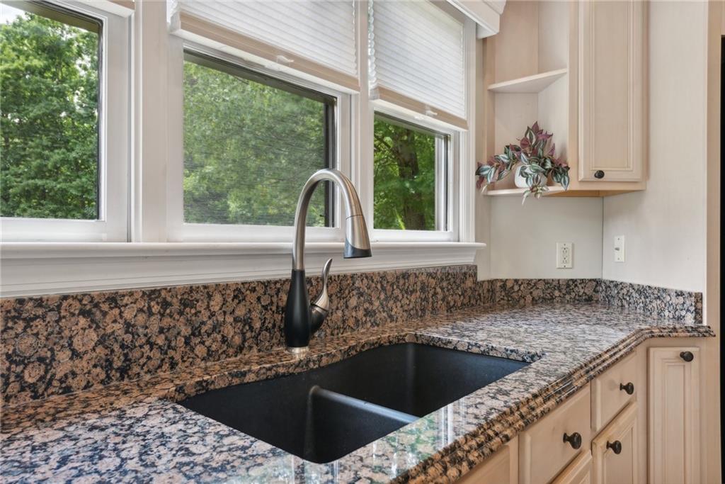 1107 Laurelview Drive Latrobe, PA 15650 - Photo 9 of 50 a kitchen with a sink a window and cabinets