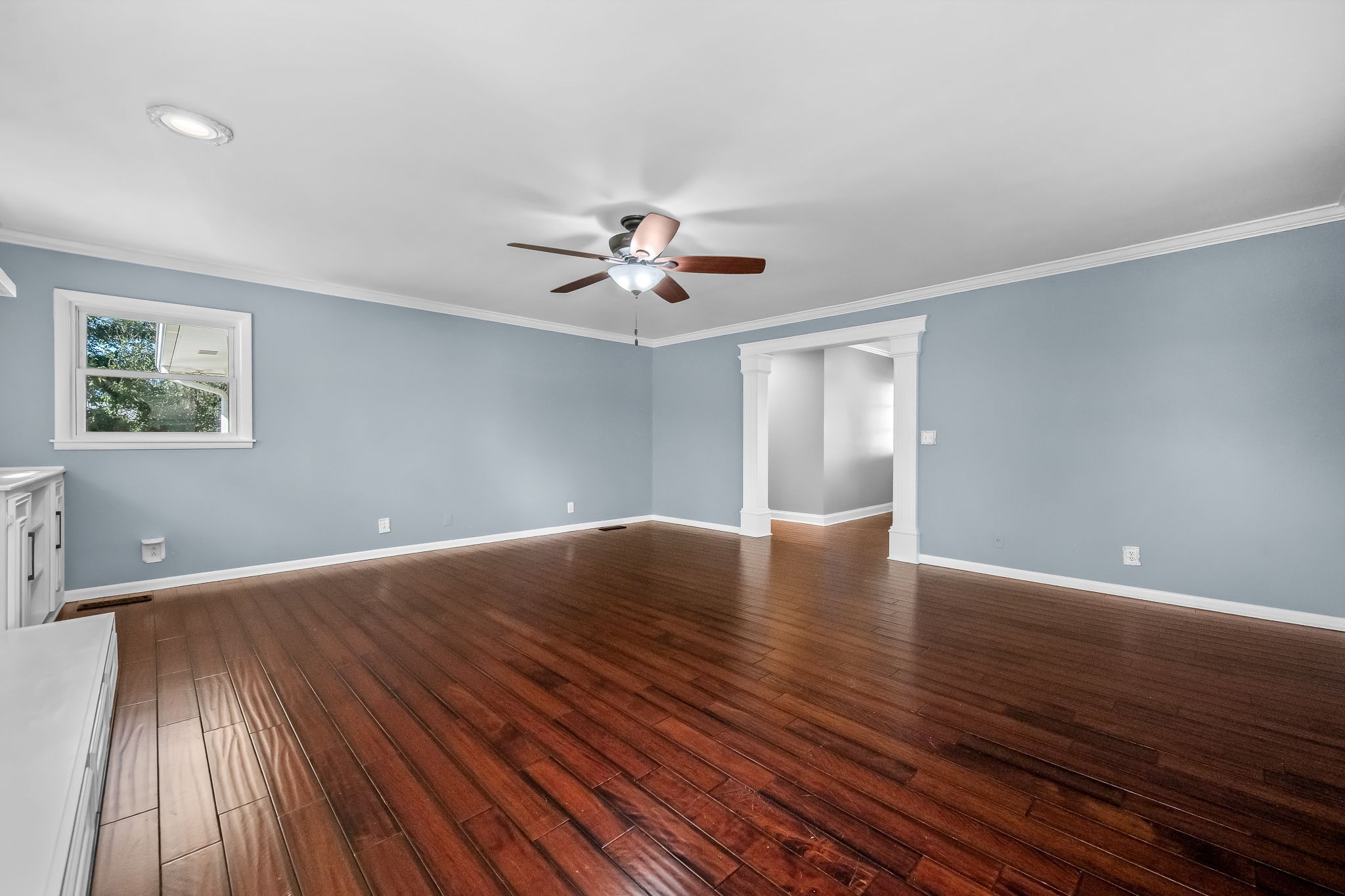 2329 Dilton Mankin Road Murfreesboro, TN 37127 - Photo 41 of 95 a view of an empty room with wooden floor and a ceiling fan