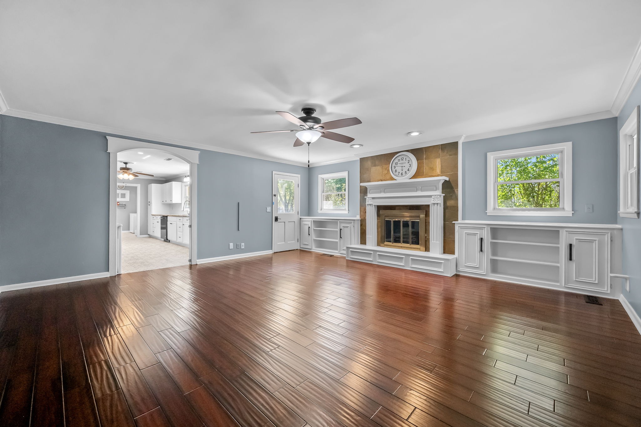 2329 Dilton Mankin Road Murfreesboro, TN 37127 - Photo 43 of 95 a view of an empty room with wooden floor fireplace and a window